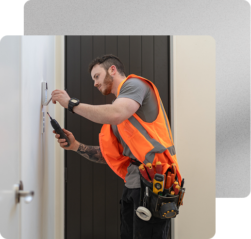 Security technician installing access control system