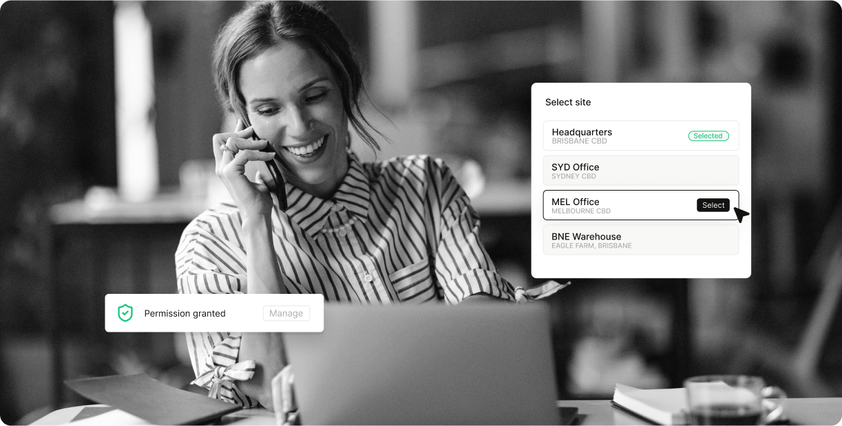 Professional woman using Zezamii Cloud platform on laptop while on phone call, with site selection and permission management interface overlays